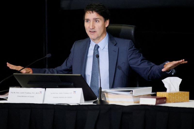 Canada to cut immigration to ease housing, social services strain