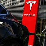 Tesla, Adobe among Friday’s market cap stock movers