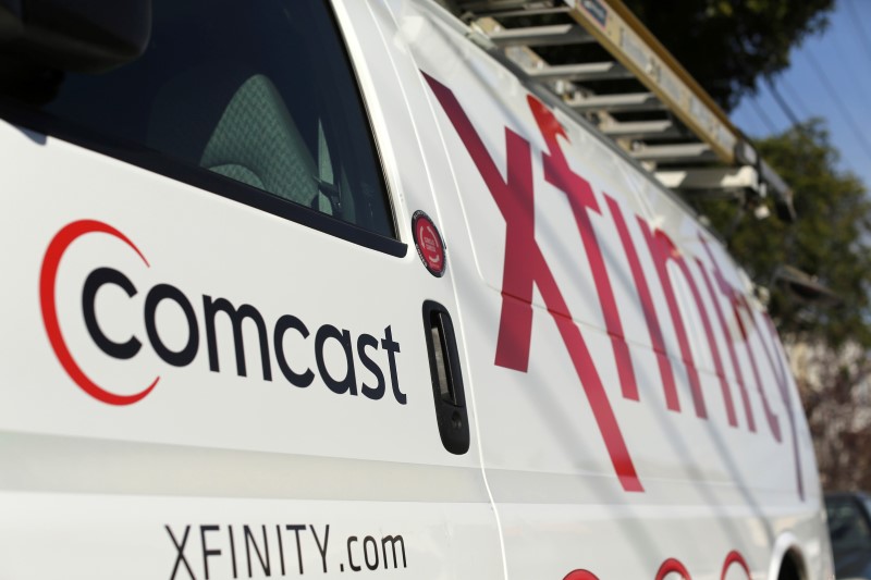 Comcast to proceed with plans to spin off its cable channels, sources say