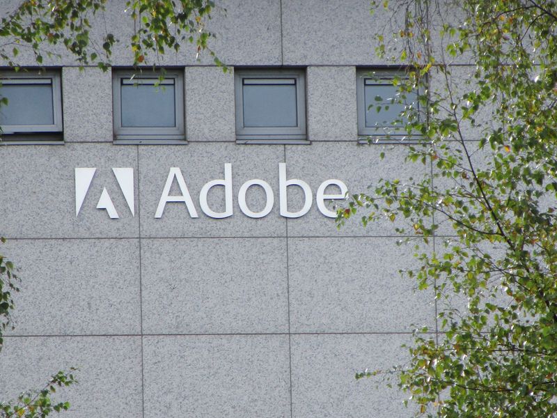 Adobe falls as annual revenue forecast triggers concerns on delayed AI returns