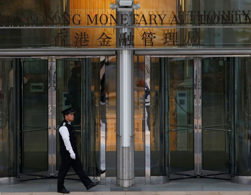 Hong Kong central bank cuts interest rate, tracking Fed move