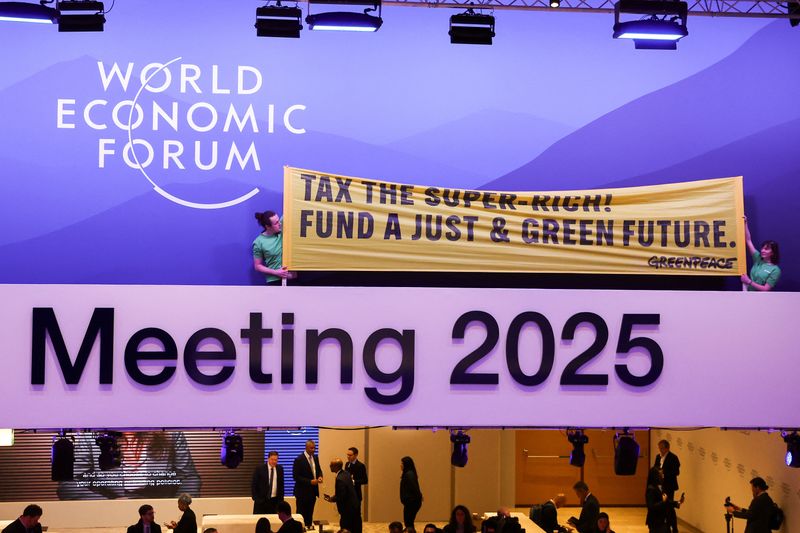 Greenpeace activists stage climate protest inside WEF meeting in Davos